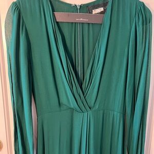 The Reformation green maxi dress with deep v neck, sheer long sleeves and slit